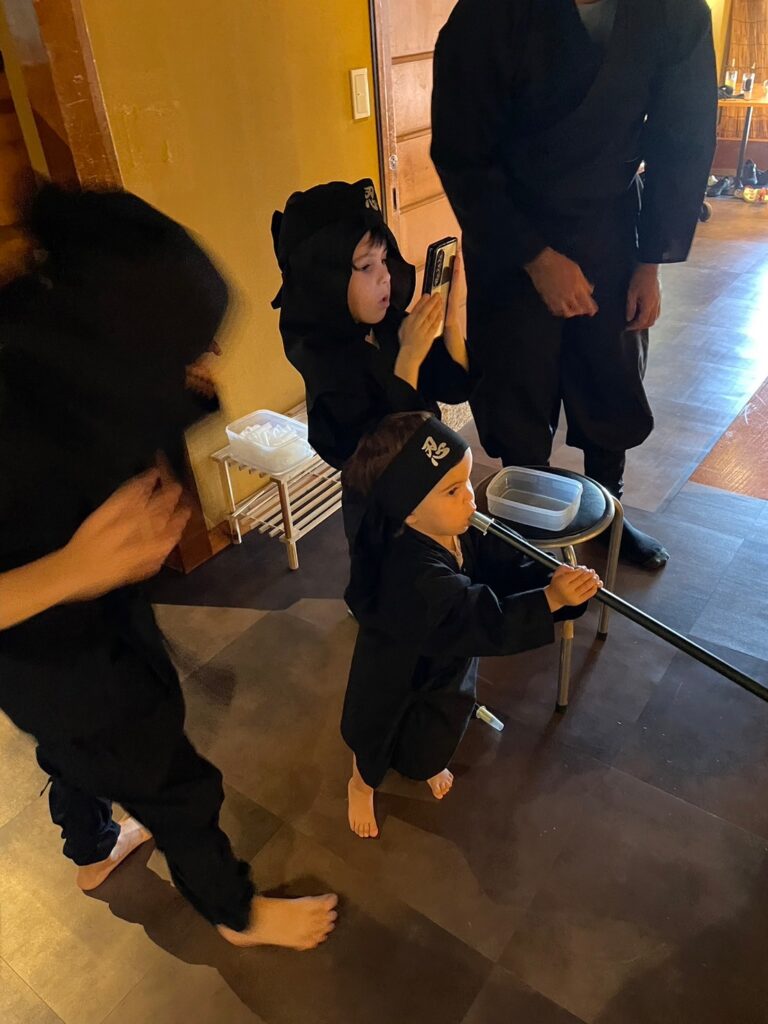 kyoto-baby-blowing-darts